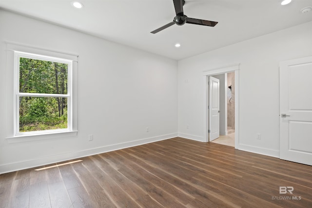 659 Island Way, Gulf Shores, AL 36542 - unfurnished bedroom featuring baseboards, recessed lighting, wood finished floors, ensuite bathroom, and ceiling fan