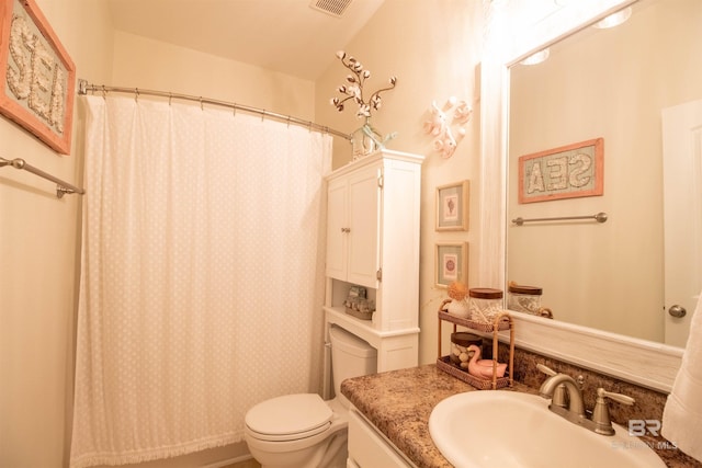 full bathroom with visible vents, a shower with shower curtain, toilet, and vanity