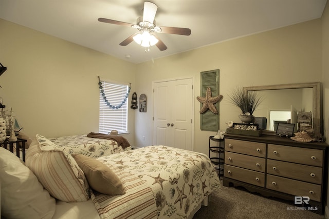 bedroom featuring a closet, carpet flooring, and ceiling fan