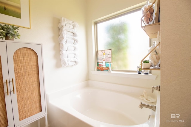 bathroom featuring a bath