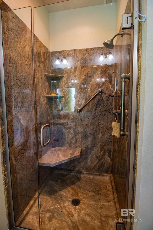 full bath featuring a marble finish shower