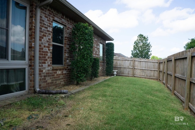 view of yard with a fenced backyard