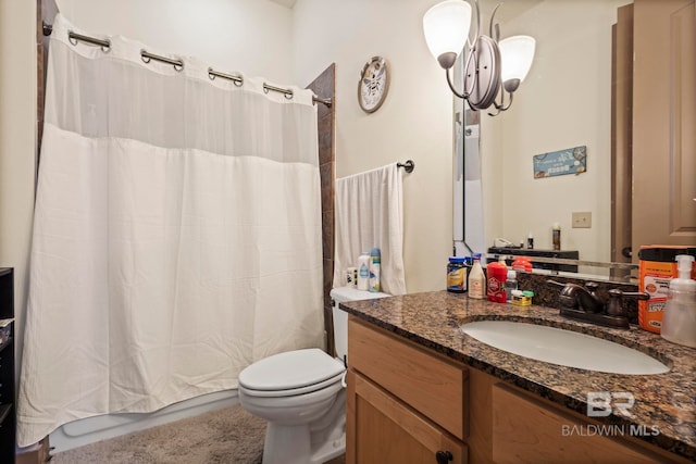 bathroom with vanity, toilet, and a shower with curtain