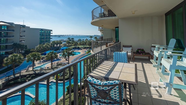 balcony featuring a water view