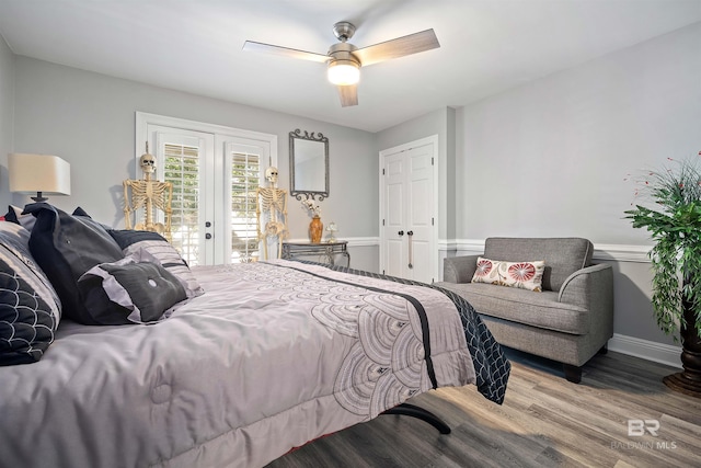 bedroom with french doors, hardwood / wood-style flooring, access to outside, and ceiling fan