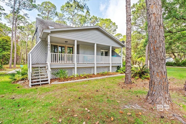 view of front of house with a porch and a front lawn