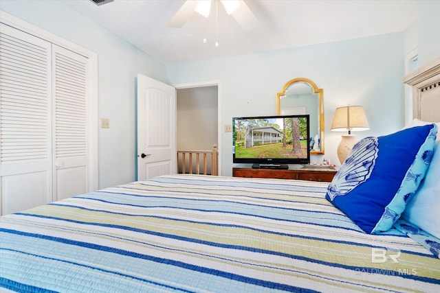 bedroom with ceiling fan and a closet