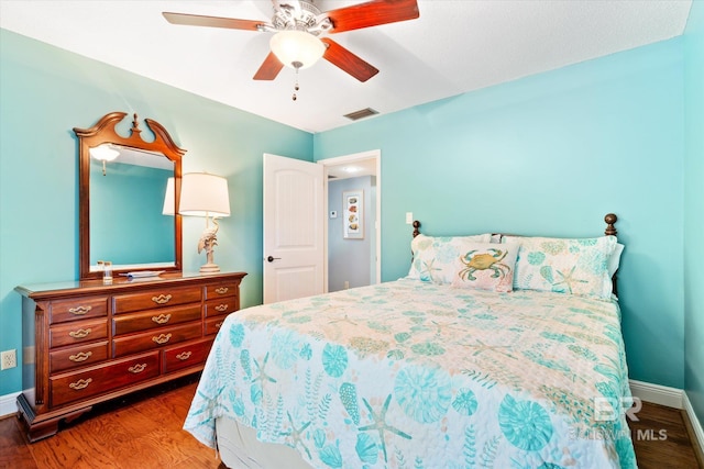 bedroom with hardwood / wood-style floors and ceiling fan