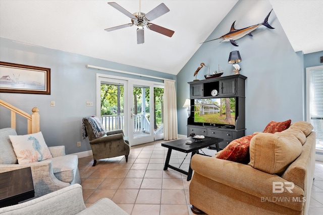 tiled living room featuring ceiling fan and high vaulted ceiling