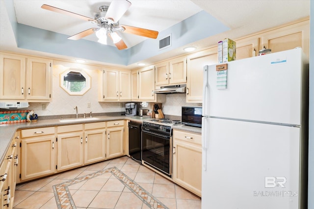 kitchen featuring light tile patterned floors, sink, tasteful backsplash, and black appliances