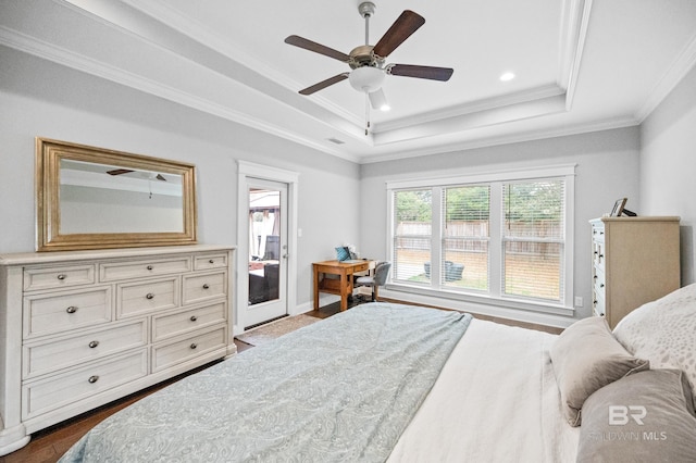 bedroom featuring hardwood / wood-style flooring, ceiling fan, ornamental molding, access to outside, and a raised ceiling