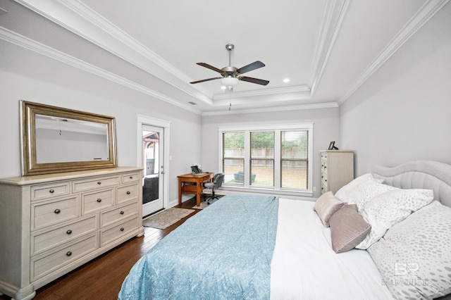 bedroom featuring ceiling fan, ornamental molding, dark hardwood / wood-style flooring, access to outside, and a raised ceiling