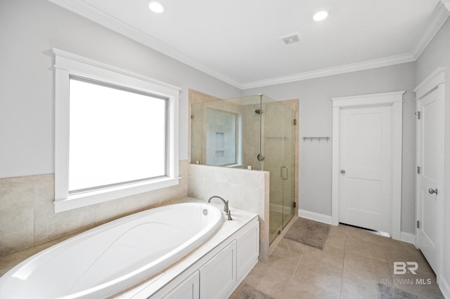 bathroom with tile patterned flooring, ornamental molding, and separate shower and tub