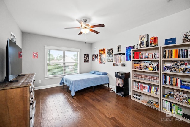 bedroom with dark wood-type flooring and ceiling fan