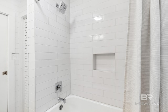 bathroom featuring shower / tub combo with curtain