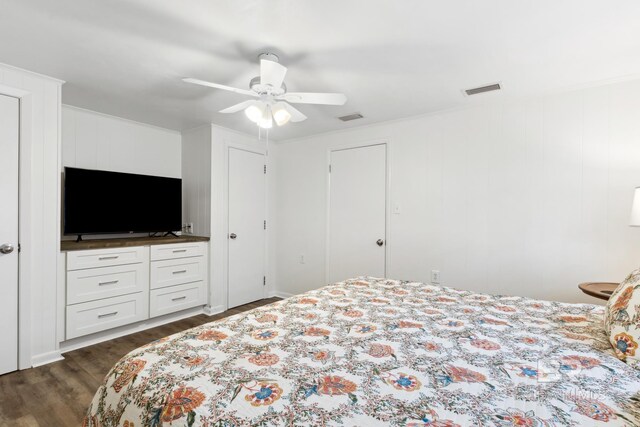 bedroom with ceiling fan and dark hardwood / wood-style flooring