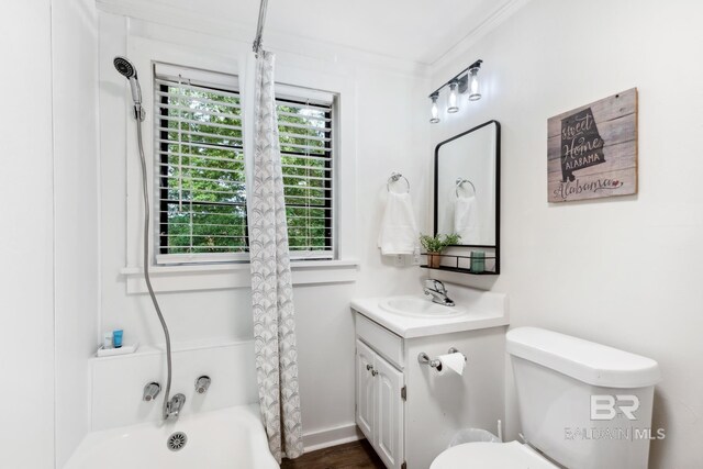 full bathroom featuring crown molding, vanity, toilet, and shower / bath combination with curtain