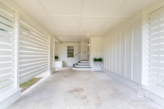 view of patio featuring an attached carport and entry steps