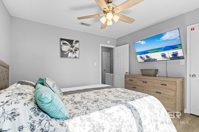 bedroom featuring wood-type flooring and ceiling fan