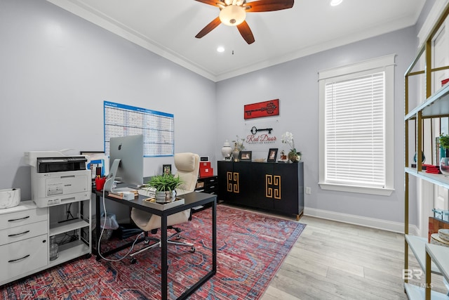 office space featuring ceiling fan, a healthy amount of sunlight, and light hardwood / wood-style floors