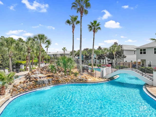 view of pool featuring pool water feature