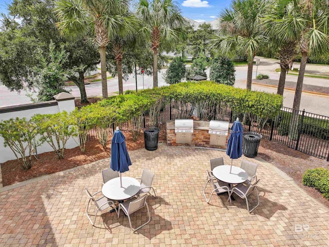 view of patio / terrace featuring an outdoor kitchen and a grill