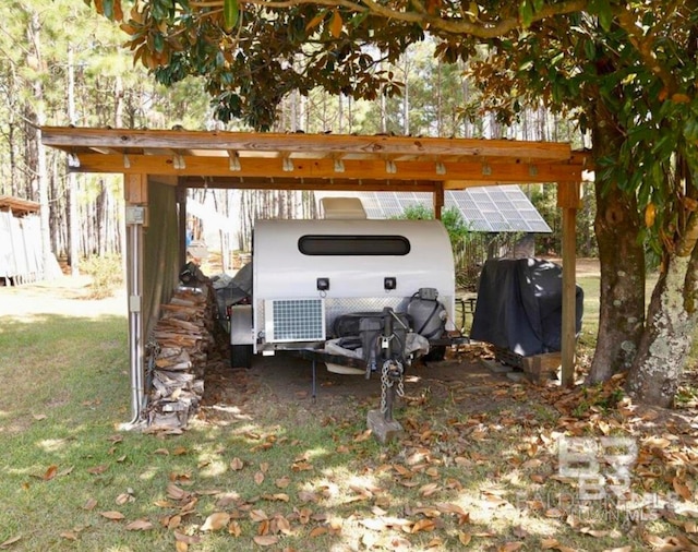 view of parking featuring a detached carport