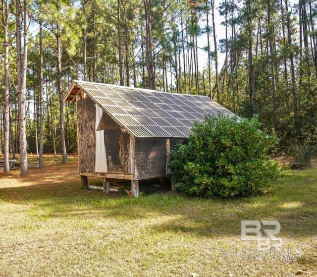 view of outdoor structure with solar panels