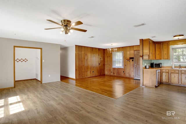 kitchen featuring a healthy amount of sunlight, light wood-style floors, visible vents, and dishwashing machine