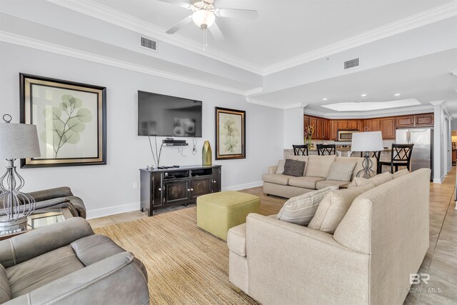 23450 Perdido Beach Blvd Unit 2707, Orange Beach, AL 36561 - living room with ornamental molding, a raised ceiling, and ceiling fan
