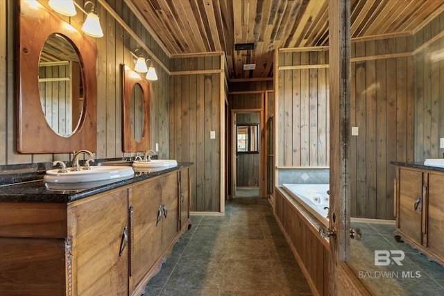 full bathroom with double vanity, a sink, and a bath