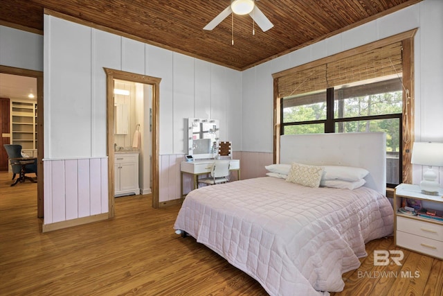 bedroom featuring wooden walls, ceiling fan, wood finished floors, lofted ceiling, and wood ceiling
