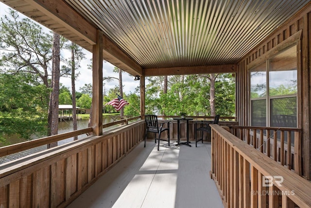 balcony featuring a water view