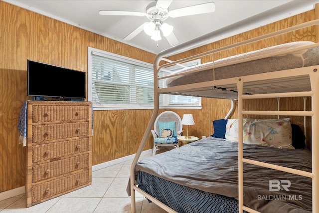 tiled bedroom featuring wood walls