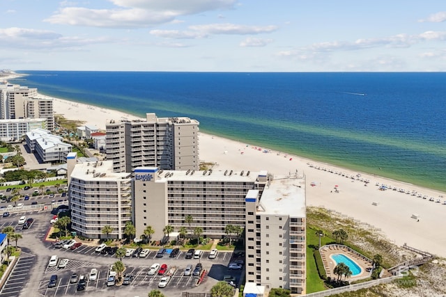 drone / aerial view featuring a view of the beach and a water view