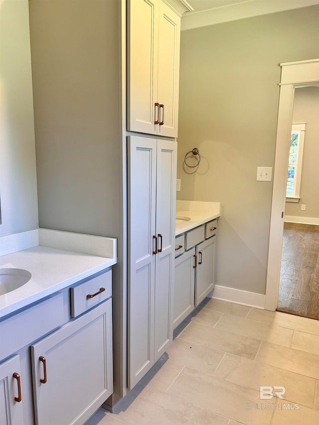 bathroom with wood-type flooring and vanity