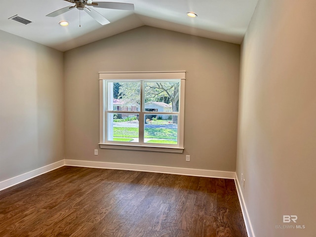 empty room featuring lofted ceiling, ceiling fan, and dark hardwood / wood-style flooring