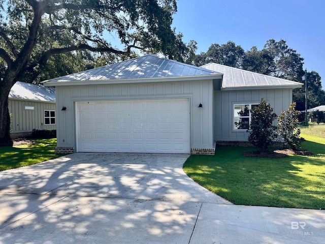 ranch-style home with a garage and a front yard