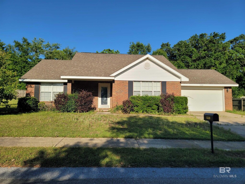 13520 Sartoris Ct, Foley, AL 36535 - view of front facade featuring concrete driveway, an attached garage, a front yard, and brick siding