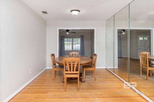 dining room featuring light hardwood / wood-style flooring and ceiling fan