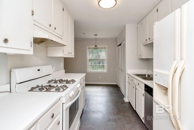 kitchen with pendant lighting, white appliances, white cabinetry, and sink