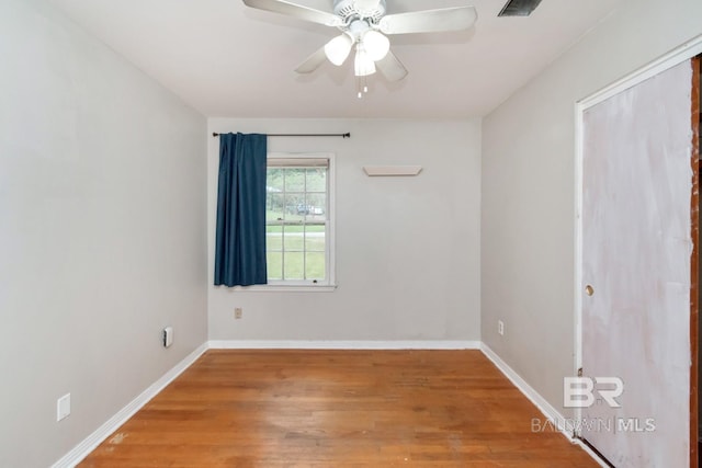 unfurnished room with ceiling fan and hardwood / wood-style floors