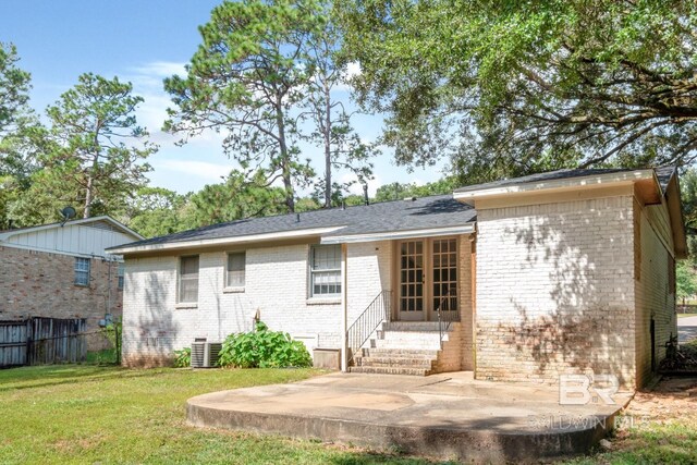 back of house with a yard