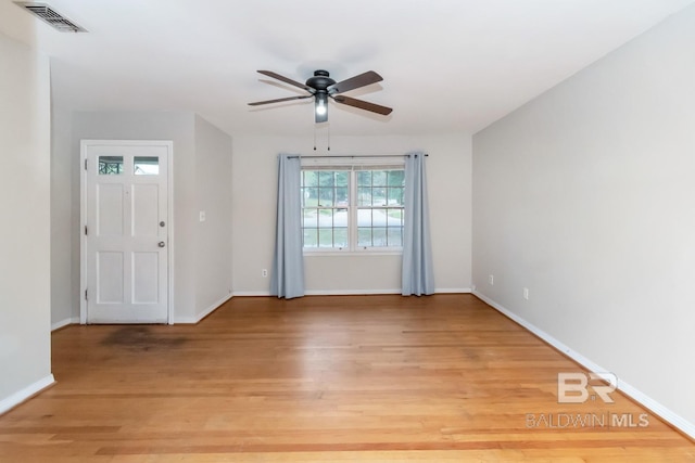 spare room featuring light hardwood / wood-style floors and ceiling fan