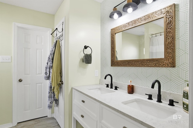 bathroom with vanity and hardwood / wood-style floors