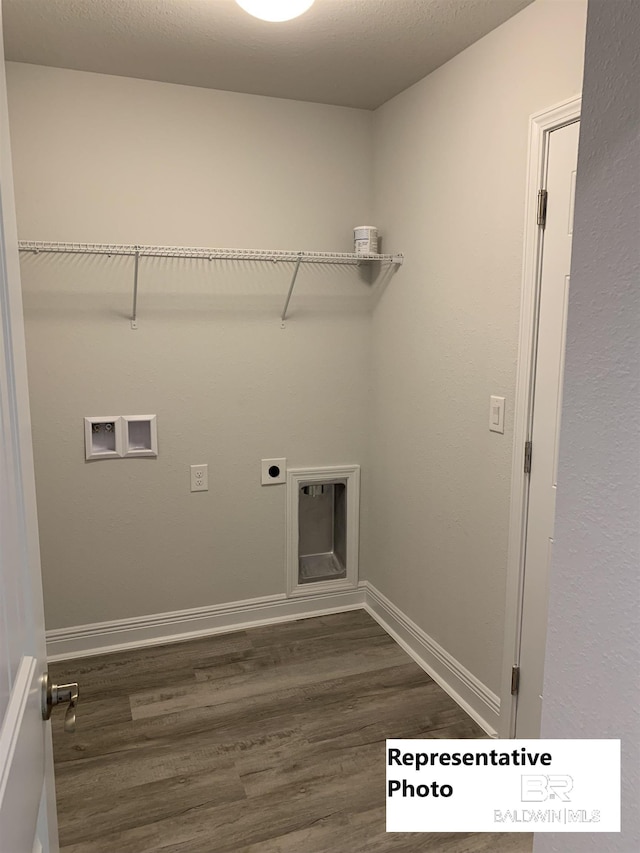 clothes washing area featuring hookup for a washing machine, hookup for an electric dryer, and dark hardwood / wood-style flooring