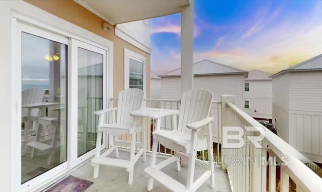 572 E Beach Blvd Unit 318, Gulf Shores, AL 36542 - view of balcony at dusk
