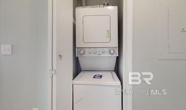 572 E Beach Blvd Unit 318, Gulf Shores, AL 36542 - laundry area with stacked washer and clothes dryer