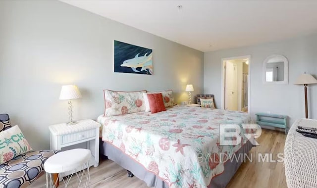 572 E Beach Blvd Unit 318, Gulf Shores, AL 36542 - bedroom featuring wood finished floors