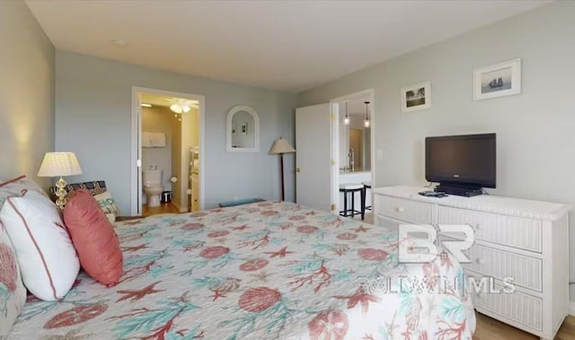 572 E Beach Blvd Unit 318, Gulf Shores, AL 36542 - bedroom with ensuite bathroom